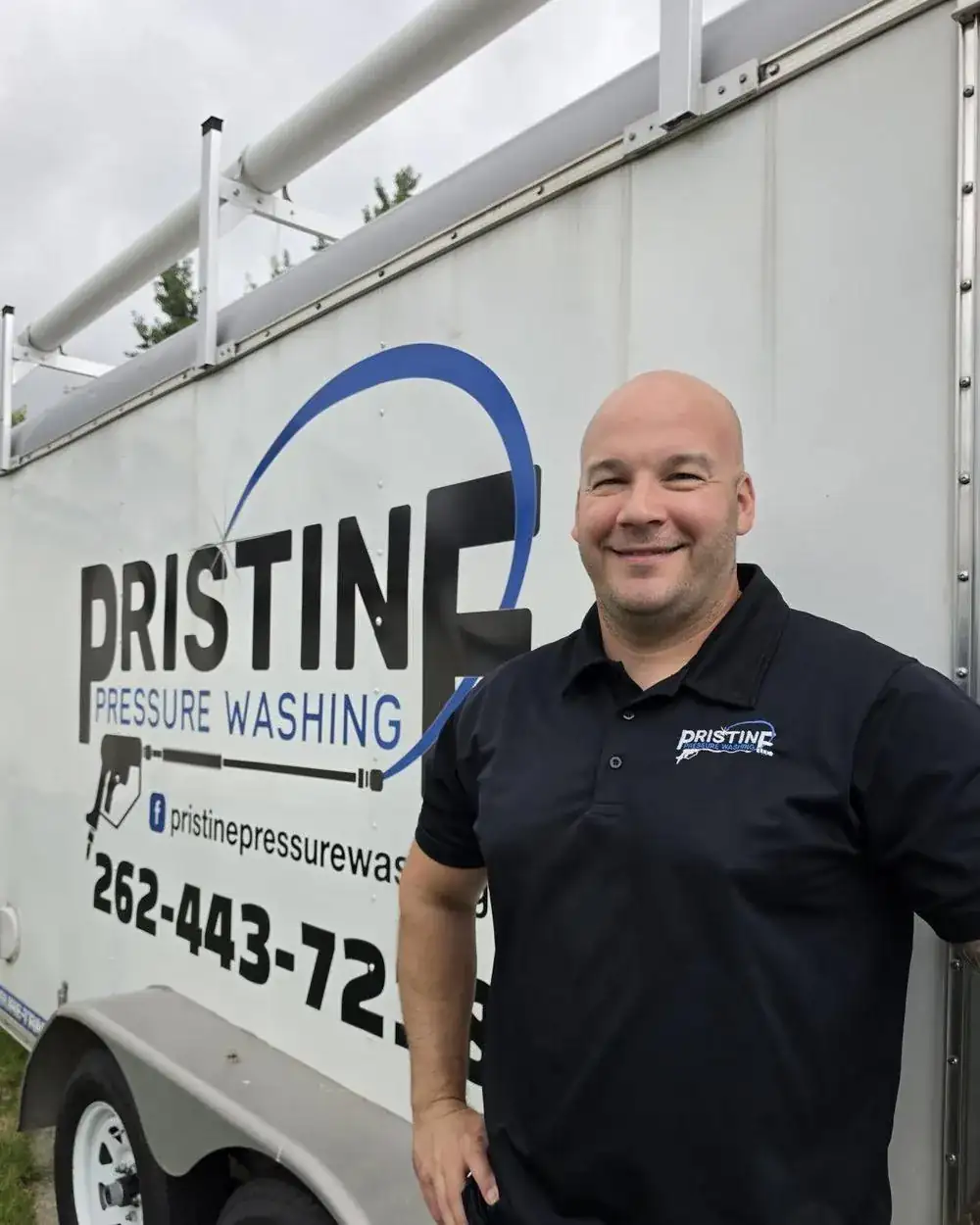 Brad Hafemann, owner of Pristine Pressure Washing, beside his work trailer in Waukesha