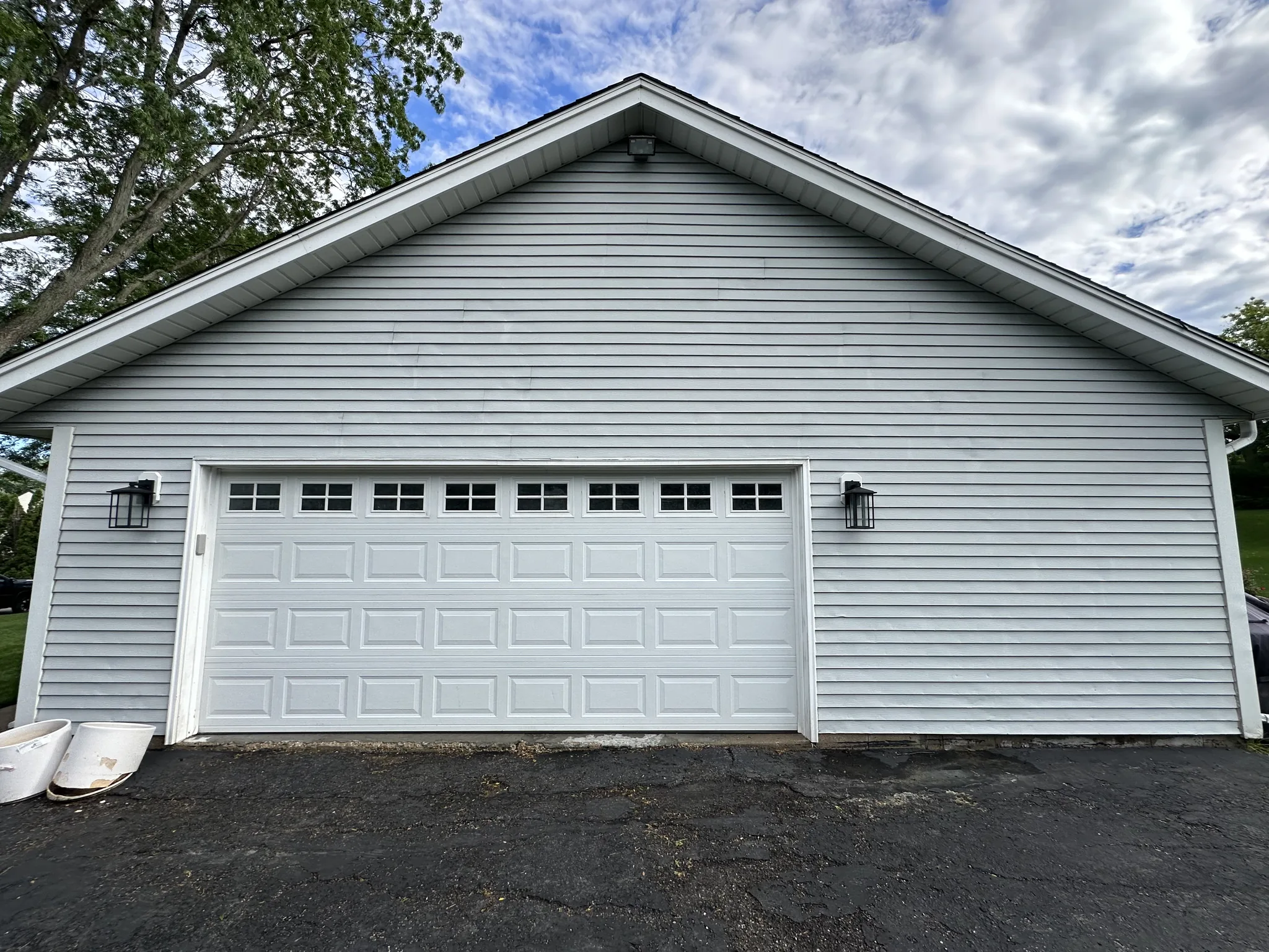 The detached garage after washing, siding and trim clean