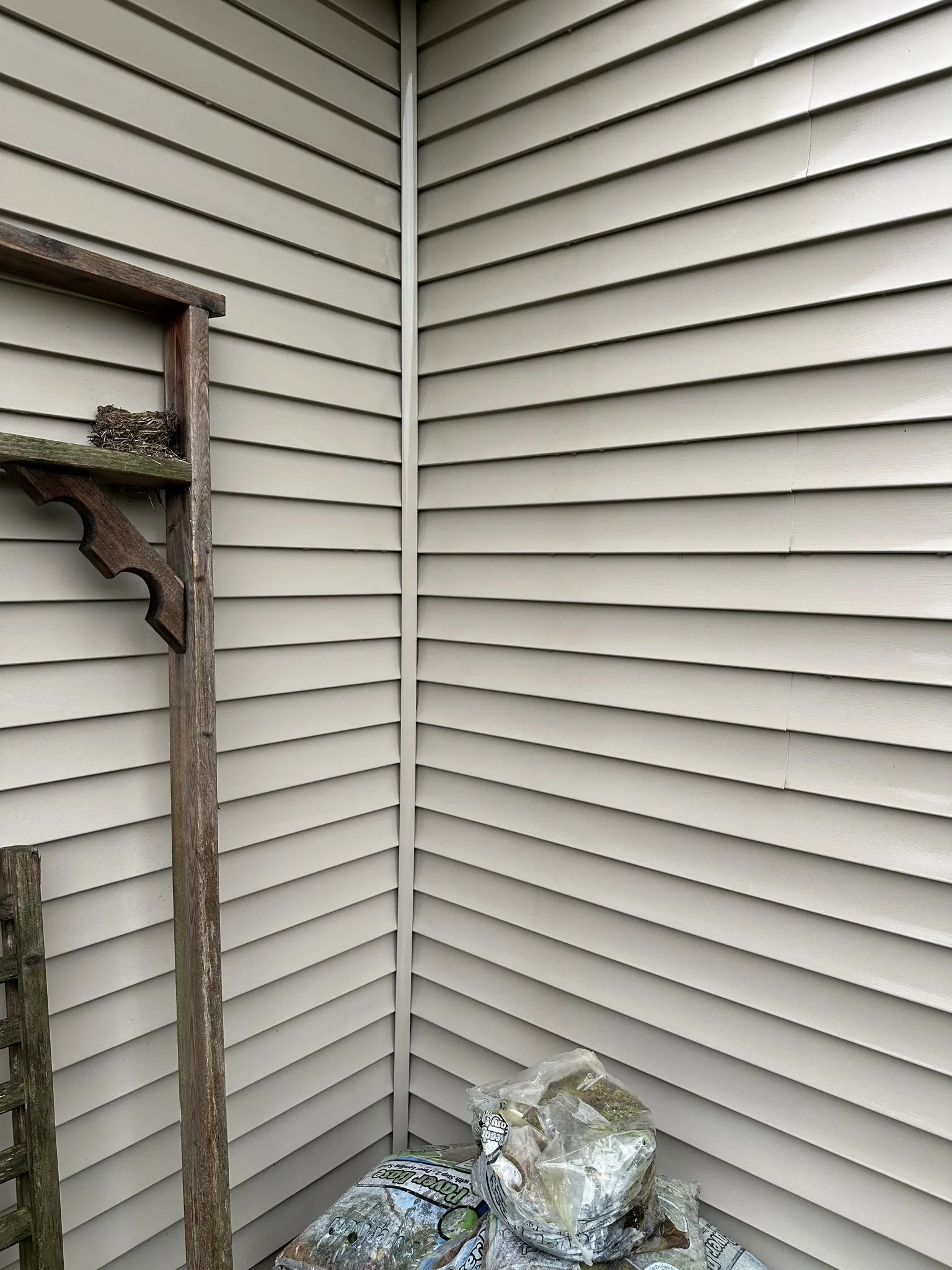 The shaded alcove corner after washing, streaking cleared off the siding